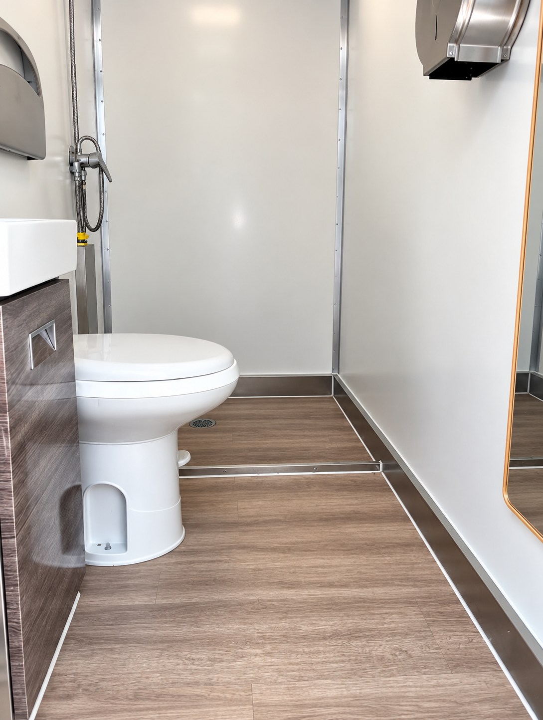 Interior of a 13 ft three-stall luxury shower and restroom combination trailer
