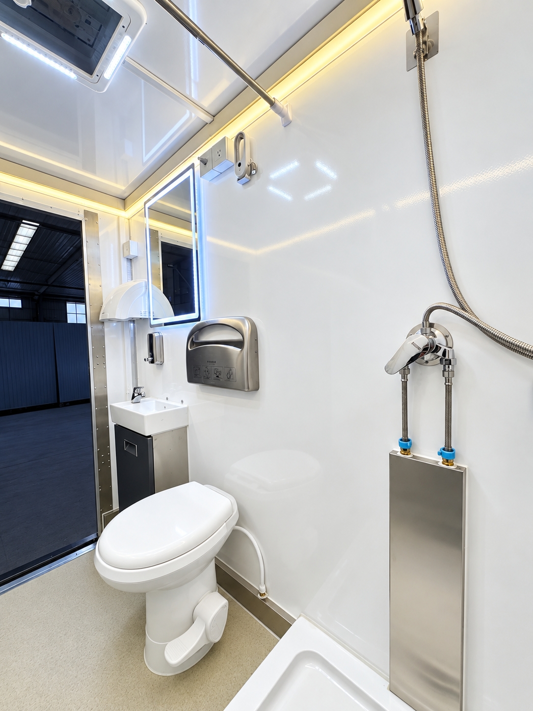 Interior of an 8-stall plus 1 ADA luxury shower and restroom combination trailer